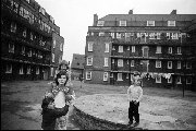 Clown visiting Vauxhall housing estate London - 1973